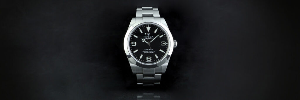 stainless steel rolex on a black background showing one option for purchasing your first rolex