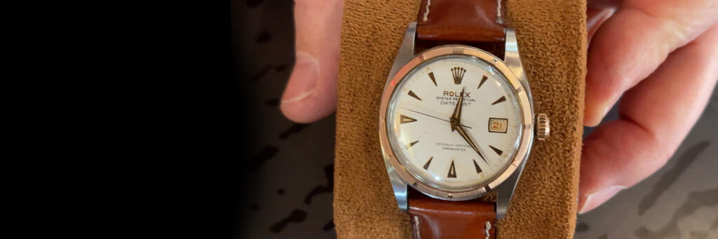 vintage rolex with a brown leather strap